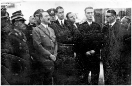 I.G. Farben board member Fritz ter Meer (fifth from right) explains to Adolf Hitler the significance of synthetic rubber, Berlin, 1936